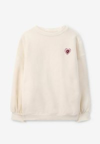 Crème sweatshirt met een ronde halslijn, verzamelde mouwen en een roze hartapplicatie, met een gedetailleerde omtrek in roze stippen en een zwarte kern.