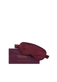Bordowy luksusowy jedwabny opaska na oczy w dopasowanym opakowaniu. Maska jest gładka z elastycznym paskiem; pudełko ma złoty napis i akcenty gwiazd.