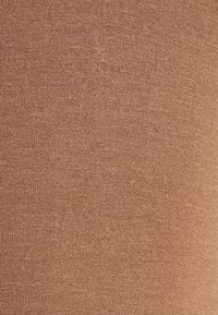 Brown knitted fabric with a soft texture, featuring a consistent weave pattern and even color distribution throughout.