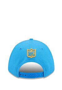 Blue baseball cap with a structured design, featuring a yellow NFL logo embroidered on the back and a snapback closure for size adjustability.