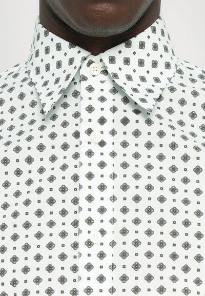Button-up shirt in light mint with intricate black geometric patterns; features a classic collar and white plastic buttons.