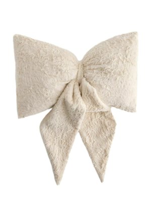 Soft, fluffy beige bow made from a plush fabric, with two large loops and two pointed tails hanging down.