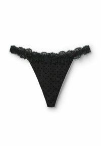 String noir avec un motif à pois et une bordure en dentelle le long de la taille. Fabriqué en matériau transparent avec un dos effilé.