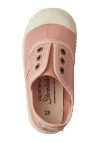 Pink canvas shoe with beige rubber sole, elasticated laces, and circular eyelets. Interior label displays size and brand. Smooth texture.