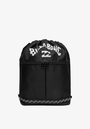 Black Billabong drawstring backpack with a front zipper pocket and wave logo near the top and bottom trim.