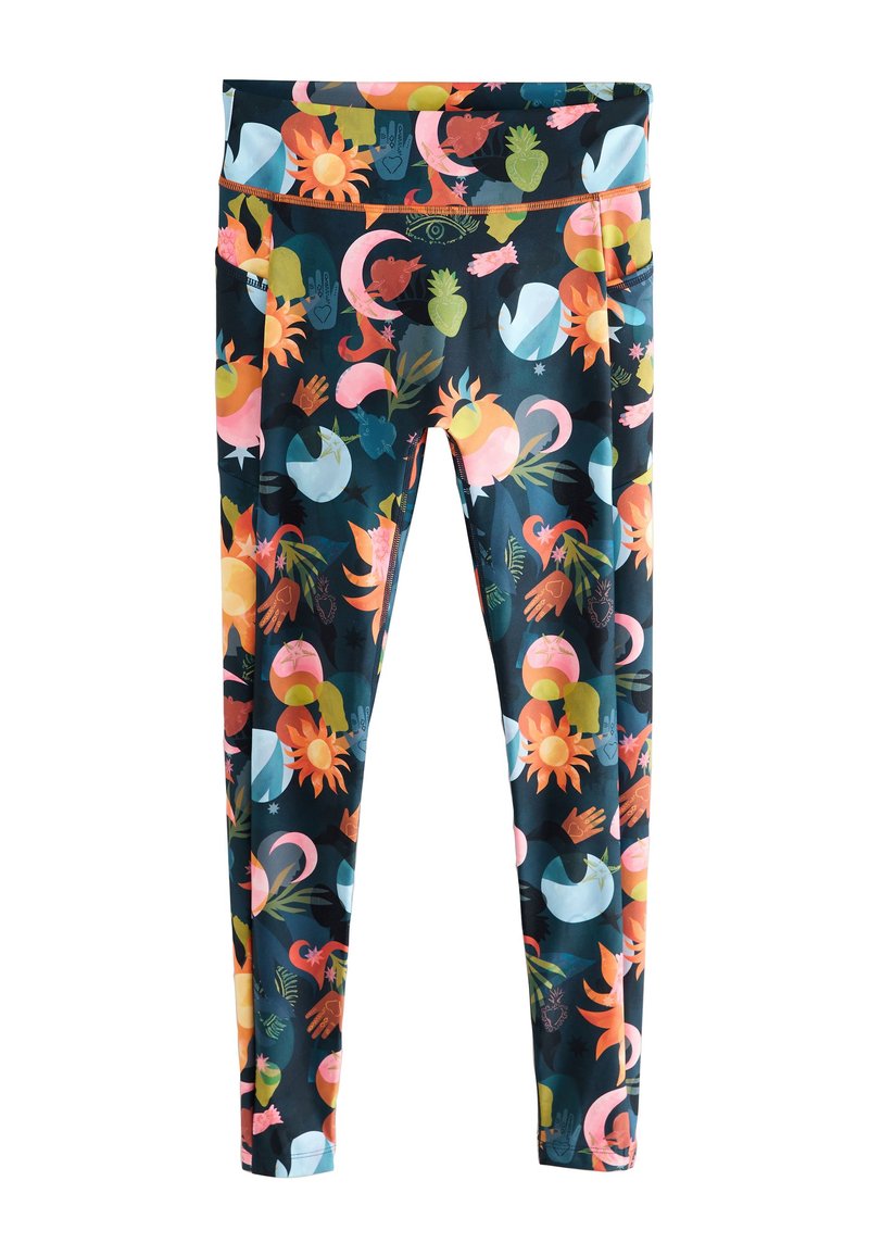 Leggings imprimés avec un motif vibrant de soleils, de mains et de diverses formes en couleurs telles que rose, vert et bleu sur un fond sombre.