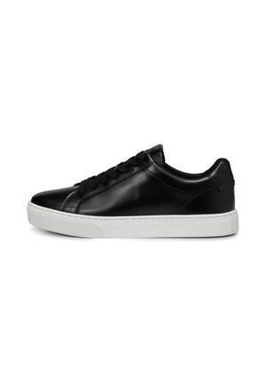 Black low-top leather sneaker with black laces and thick white rubber sole, shown from the side on a white background.