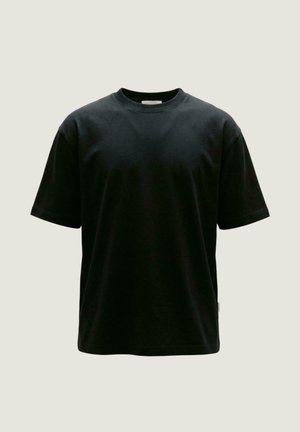 T-shirt nera in cotone a maniche corte con scollo tondo, mostrata su uno sfondo chiaro e neutro.