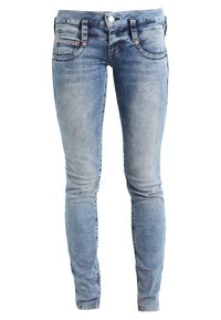 Modré džíny skinny s vybledlým ombre efektem, se zapínáním na knoflík vpředu, pěti kapsami a jemnými detaily šití.