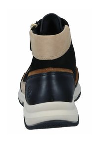 High-top sneaker featuring black suede, beige suede collar, and brown leather accents. Visible zipper detail and white outsole.