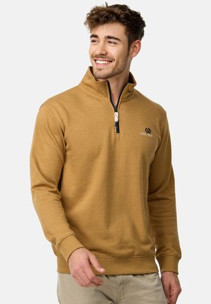 Zipper sweatshirts i sennepsgul, lavet af blødt stof. Har en høj krave, ribbede manchetter og et broderet logo på brystet.