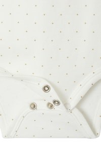 White bodysuit with small gold dot pattern, featuring snap closures at the bottom, soft cotton material, and rounded neckline.