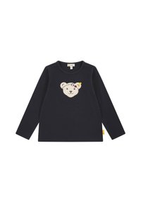 Langärmliges navy Shirt mit einem Bärenkopf-Applikation, Sternen und einem gelben Akzent. Weicher Baumwollstoff mit rundem Ausschnitt.