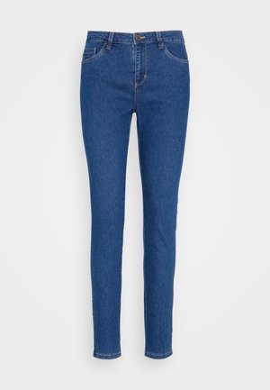 Slanke jeans i medium blå denim med mid-rise talje, fem-lomme design og subtile syninger. Glat tekstur og klassisk pasform.