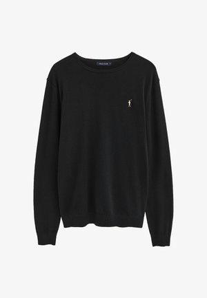 Maglione nero girocollo con maniche lunghe e piccolo logo beige del giocatore di polo sul petto a sinistra, polsini e orlo a costine, etichetta all'interno del colletto.