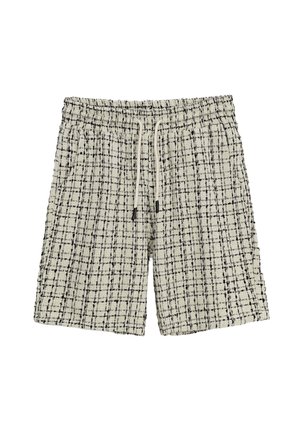 Shorts à carreaux noirs et blancs avec une taille élastique et un cordon de serrage, dotés d'un tissu texturé et d'une coupe décontractée.