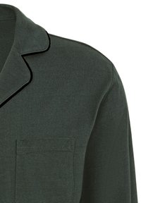 Dark green cotton shirt with a notch collar, black piping, and a chest pocket. The fabric has a smooth texture and is lightweight.
