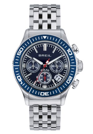 Kronografur med et hus og armbånd i rustfrit stål. Blå bezel, marineblå urskive, tre subskiver og røde accenter på visere og markører.