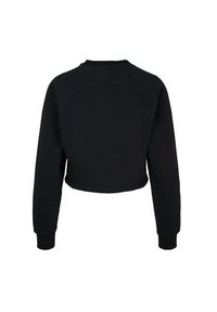 Sweat-shirt court noir avec manches longues, poignets côtelés et une couture arrondie traversant le haut du dos.