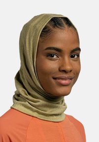 Olive green, stretchy, textured scarf draped around the head, paired with a bright coral top featuring a smooth surface and modern design.