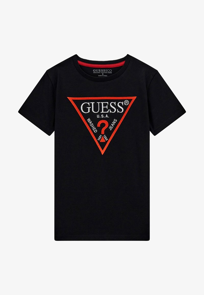 Must–must värvi puuvillane t-särk, millel on punane ja valge kolmnurgalogo, kus on kirjas "GUESS U.S.A." ja "WASHED JEANS". Klassikaline ümmargune kaelus.