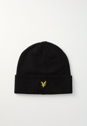 Czarny beanie wykonany z miękkiej dzianiny. Posiada podwinięty ściągacz i żółte haftowane logo orła z przodu.