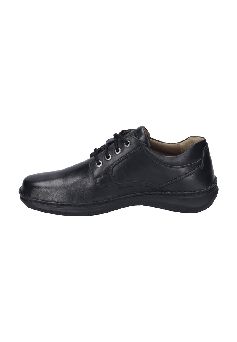 Chaussure en cuir noir avec bout rond, cinq œillets pour les lacets, intérieur rembourré et finition lisse ; elle dispose d'une semelle en caoutchouc flexible.