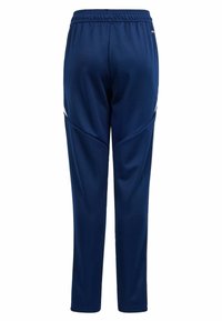 Marineblauwe sportbroek gemaakt van een zachte stof, met een rekbare tailleband en een slank zijontwerp met witte accenten.
