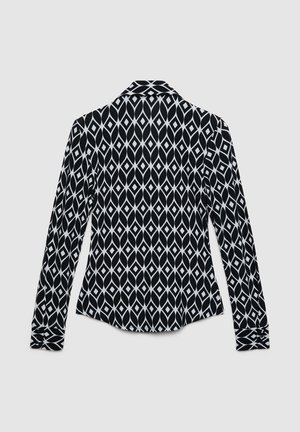 Langarmhemd in Schwarz mit weißem Diamantmuster. Verfügt über einen Kragen und geknöpfte Manschetten. Glatte Stoffstruktur.