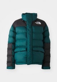 Teal og svart dunjakke med høy krage, to frontlommer og logo på venstre skulder. Kviltet tekstur øker varmen.