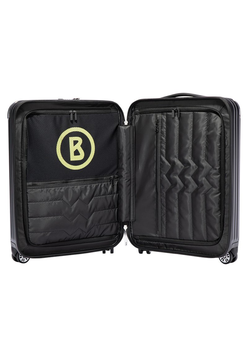 Schwarzer Hartschalenkoffer mit strukturiertem Finish. Innenausstattung mit Netzfach, Zickzackmustern und einem auffälligen gelben "B"-Logo. Doppelte Reißverschlüsse.
