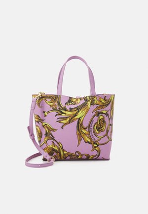 Purple tote bag with gold ornate patterns, featuring two handles and a removable shoulder strap. Material appears textured with a structured shape.