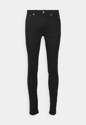 Jeans skinny noirs en denim au toucher lisse, dotés de cinq poches et d'une fermeture à bouton en métal. Design simple sans motifs.