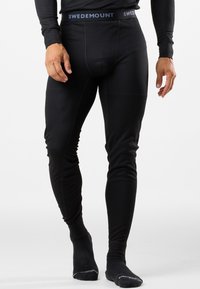 Schwarze lange Unterwäsche mit gerippter Textur, anliegendem Design und einem Bündchen mit der Aufschrift "SWEDMOUNT". Glattes Material für eine enge Passform.