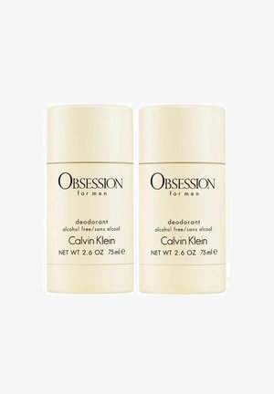 Calvin Klein Obsession for Men deodorant, kaksi tikkuvoidetta, kermaisenvärisiä, sylinterimäisiä, 75ml, alkoholitonta, mustalla tekstillä pakkauksessa.