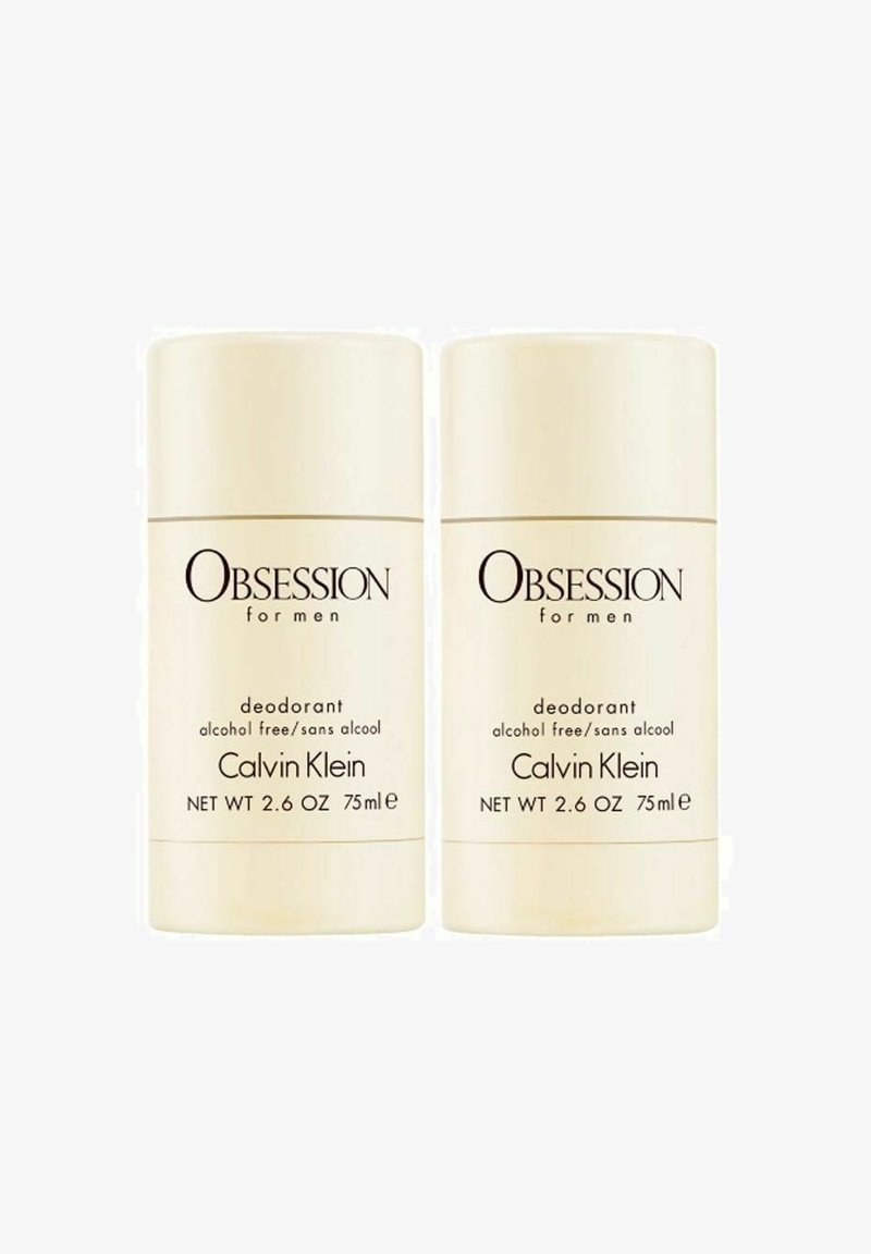 Calvin Klein Obsession for Men deodorant, to stk, cremefarvet, cylindrisk design, 75 ml, alkoholfri, med sort tekst på emballagen.
