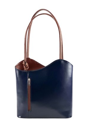 Navy blue leather handbag with curved top edge, brown interior and double brown handles, featuring a vertical front zipper pocket.