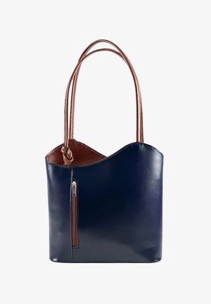 Navy blue leather handbag with curved top edge, brown interior and double brown handles, featuring a vertical front zipper pocket.