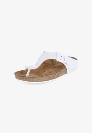 Witte teenslipper met kurken zool, bruin gevoerd voetbed en verstelbare gespsluiting op witte achtergrond.