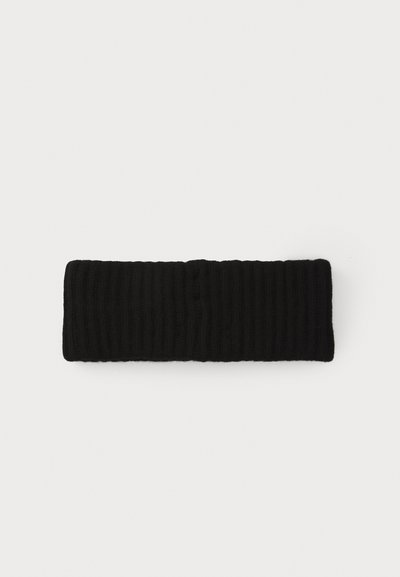 Diadema negra de punto acanalado con tejido texturizado, diseñada para ajustarse bien, con una construcción sin costuras y sin hardware visible.