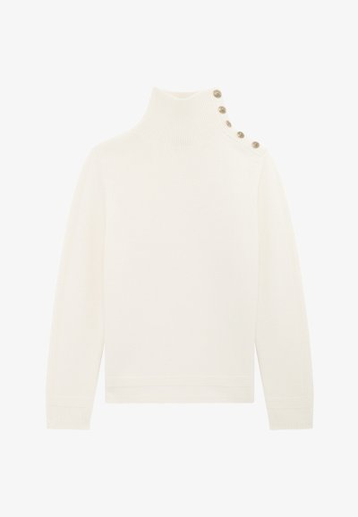Cream-colored ribbed turtleneck sweater with long sleeves and four decorative gold buttons along the left shoulder.