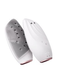 Brosse de nettoyage facial électronique blanche avec une surface en silicone texturée grise, en forme arrondie, boutons de contrôle et accent de base rose doré.