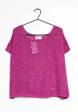 Purple short-sleeve knit top with chevron lace pattern on black hanger against white background.