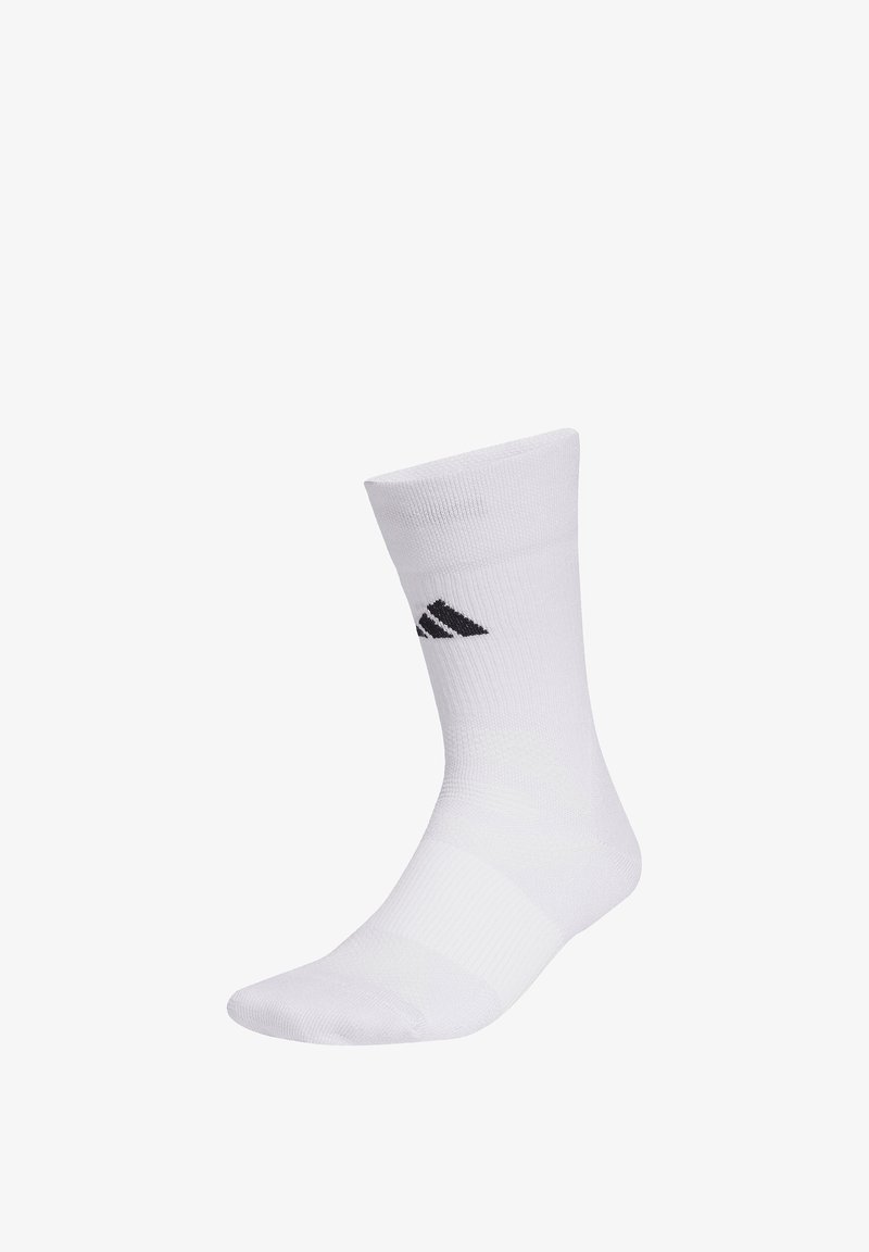 Chaussette de sport blanche montant jusqu'au milieu du mollet avec texture côtelée et logo Adidas noir sur le côté, présentée sur un fond blanc.