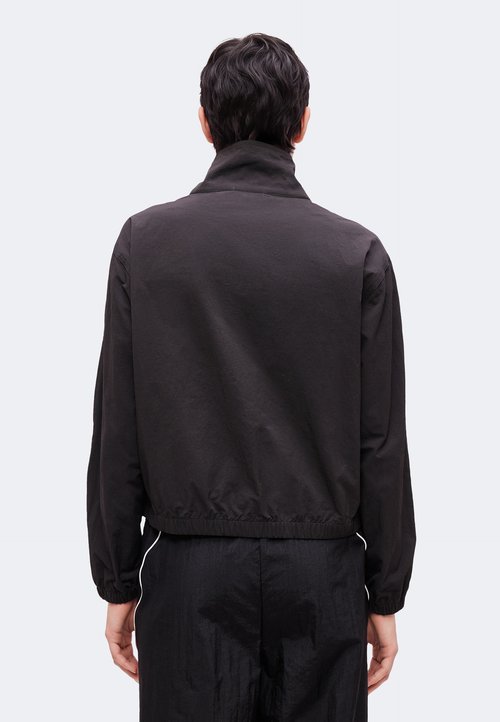 PUMA Chaquetas de Training de Mujer W Tropical Speed Moto Woven Ja Negro — photo 3
