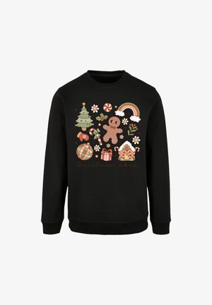 Black sweatshirt with colorful holiday-themed graphics including a Christmas tree, gingerbread man, candy canes, gifts, and a rainbow.