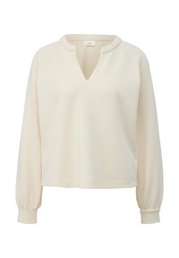 Blouse crème à manches longues avec encolure en V à encoche, poignets élastiques et ourlet droit, fabriquée en tissu lisse.