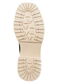 Czarna podeszwa buta z kremową, gumową podstawą. Posiada wzorzysty bieżnik z trójkątnymi kształtami zapewniającymi przyczepność. Rozmiar 38.