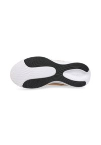 Suela de zapato que presenta una mezcla de goma negra y blanca con surcos texturizados para agarre, diseñada para tracción y soporte.