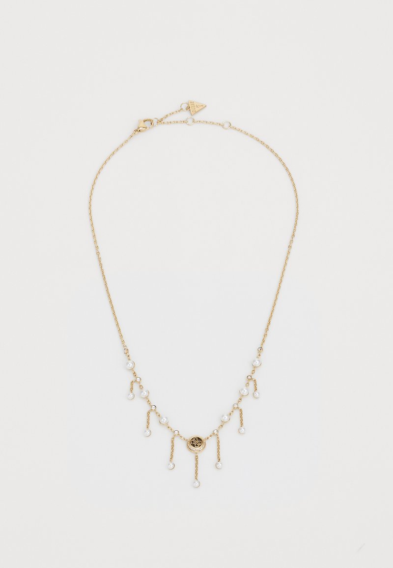 Collier en or avec plusieurs perles pendantes et un pendentif circulaire au centre, le tout avec une chaîne délicate.